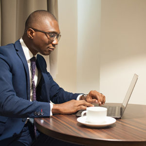 Man in suit at laptop