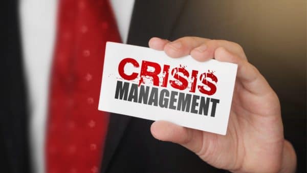 Man Holding a Crisis Management Calling Card Photo